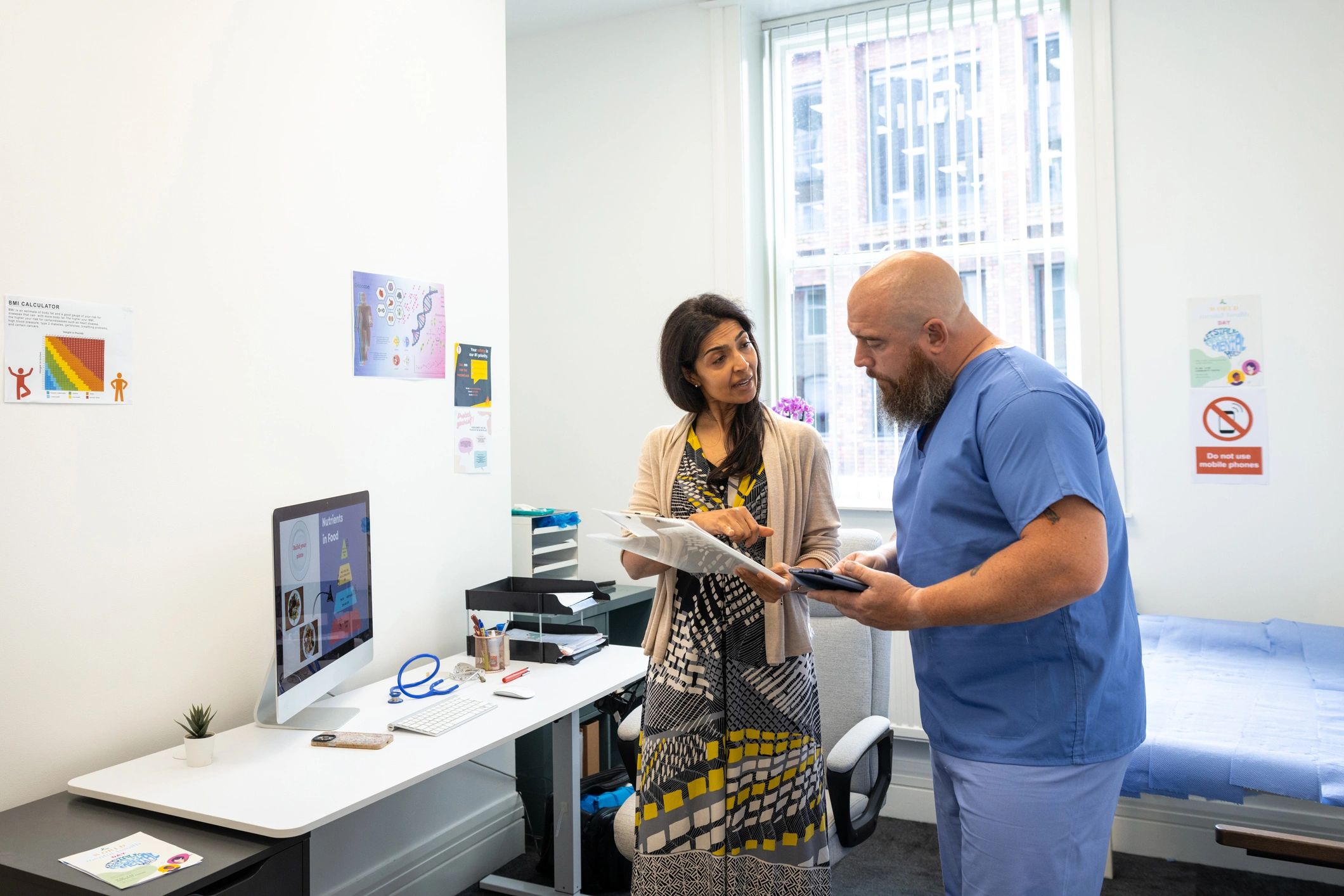 Clinical care team reviewing patient information in a professional wellness setting